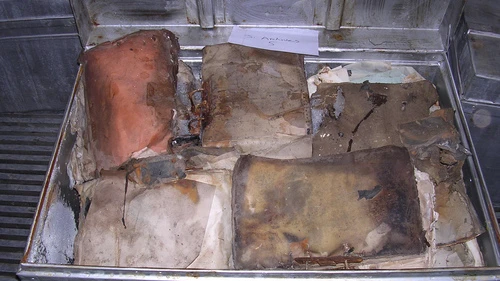 Click photo to download. Caption: Pictured before restoration, Iraqi Jewish Archive items that were recovered in by the U.S. in 2003 from the flooded basement of the Mukhabarat, Saddam Hussein’s intelligence headquarters. Credit: National Archives and Records Administration.