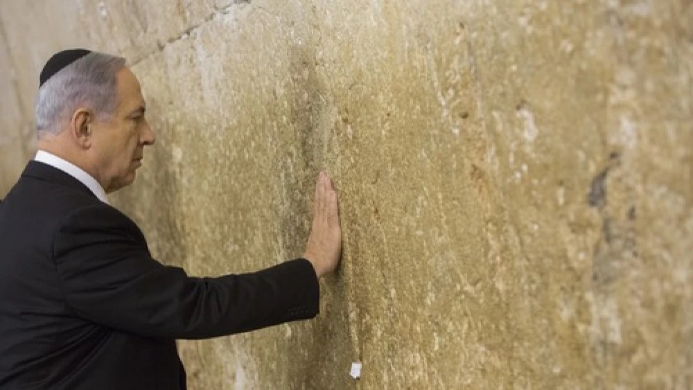 Click photo to download. Caption: Prime Minister Benjamin Netanyahu visits the Western Wall in Jerusalem's Old City on March 18, a day after the Israeli election. Credit: Yonatan Sindel/Flash90.