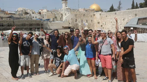 Taglit-Birthright Israel trip participants visit the Western Wall in the Old City of Jerusalem, Aug. 18, 2014. This photo was published with a recent news report on a J Street-driven letter, in which 575 Jewish students stated that Birthright has a policy of not traveling to “the West Bank.” Photo by Flash90.