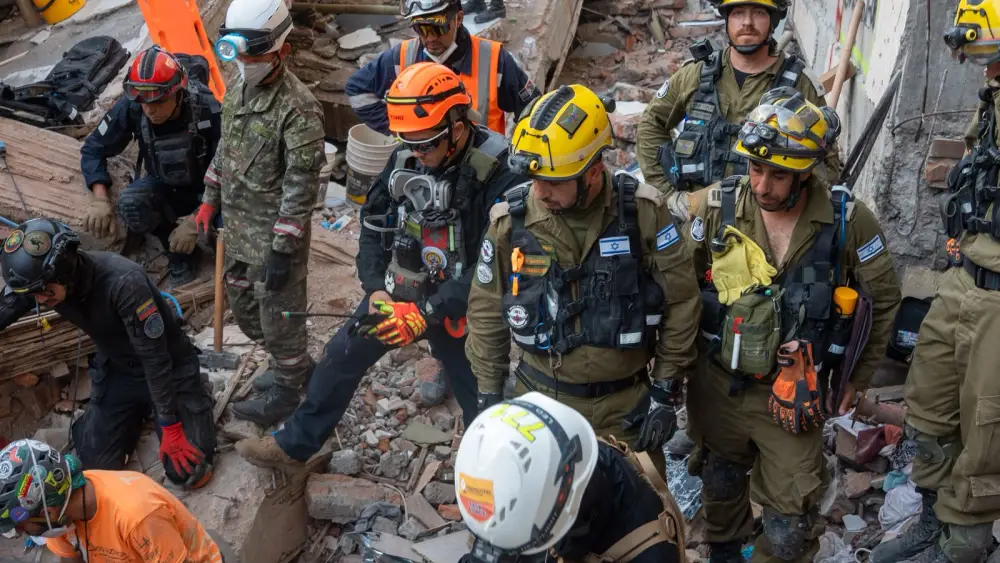 Israeli and Colombian rescue personnel work amid earthquake rubble in Cali, Colombia, on Aug. 15, 2026. The Israeli delegation is assisting local authorities in efforts to locate people trapped beneath collapsed buildings. Credit: IDF.