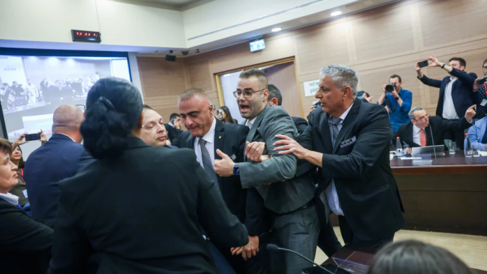 Israeli opposition lawmakers shout at members of the coalition during a meeting of the Knesset’s Constitution, Law and Justice Committee, which voted to send the first bill in the government's judicial reform package for its first reading in the full plenum, Feb. 13, 2023. Credit: Yonatan Sindel/Flash90.