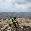 A yeshiva student learning Talmud overlooking Nablus during a tour at Joshua's Altar on Mt. Ebal in Samaria. Photo: Benjamin Sipzner.