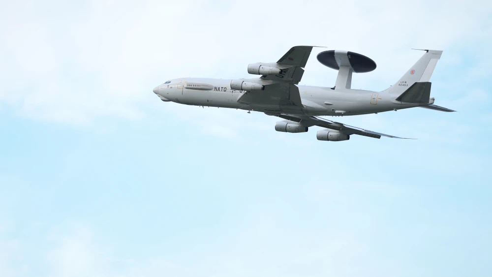 GEILENKIRCHEN, GERMANY - NOVEMBER 13: A NATO E-3A AWACS (Airborne Warning and Control System) airplane flies while NATO Secretary General Mark Rutte visiting the NATO Geilenkirchen Air Base on November 13, 2025 in Geilenkirchen, Germany. The base is the headquarters of the NATO Airborne Early Warning & Control Force (NAEW&CF). (Photo by Andreas Rentz/Getty Images)