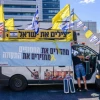 Relatives and supporters of Israelis held hostage by Hamas terrorists in Gaza prepare to leave in a convoy from Tel Aviv toward the Gaza Strip, Aug. 28, 2024. Photo by Avshalom Sassoni/Flash90.