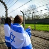 Jewish youngsters in Poland to participate in the annual March of the Living gaze into the Auschwitz-Birkenau camp site, April 16, 2015. Credit: Yossi Zeliger/Flash90.