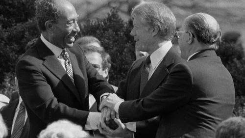 From left: Egyptian President Anwar Sadat, U.S. President Jimmy Carter and Israeli Prime Minister Menachem Begin at the White House for the signing of the 1979 Egypt-Israel peace treaty. A photo of the peace treaty's signing was added to the new edition of “The Geography of the Arab World and the History of Modern Egypt,” a ninth-grade Egyptian textbook. Credit: Warren K. Leffler via Wikimedia Commons.