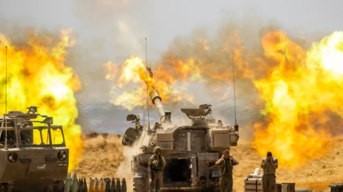 IDF Artillery Corps fire into the Gaza Strip, near the border with Israel, following heavy rocket and missile barrages into Israel by Hamas and other terror factions, May 12, 2021. Photo by Yonatan Sindel/Flash90.