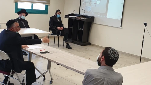 In light of the coronavirus, members of the Israeli Ministry of Affairs discuss the holiday of Lag B'Omer, and the traditional celebration and bonfires in Meron, in May 2020. Credit: Israeli Ministry of Affairs.