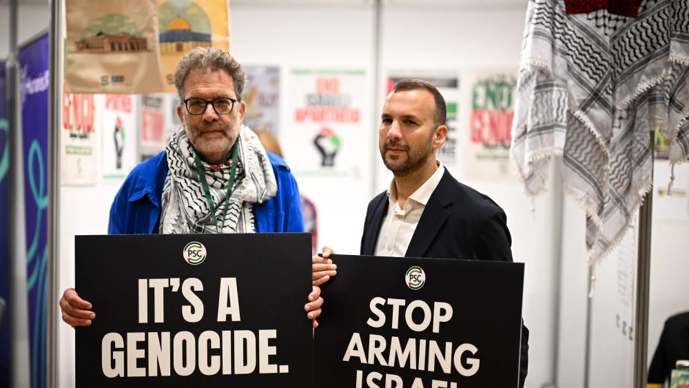 Green Party leader Zack Polanski, right, chats with Ben Jamal, director of the Palestine Solidarity Campaign, on the second day of the Green Party Conference at the Bournemouth International Centre in Bournemouth, England, Oct. 4, 2025. Photo by Finnbarr Webster/Getty Images.