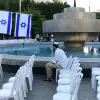 The Rosh Yehudi outreach group sets up chairs ahead of a public Yom Kippur service on Dizengoff Square in Tel Aviv on Sept. 24, 2023. Photo by Tomer Neuberg/Flash90.
