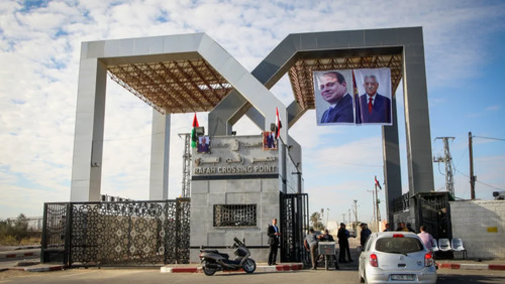 Pictures of Egyptian President Abdel Fattah el-Sisi and Palestinian Authority leader Mahmoud Abbas hang at the Rafah border crossing between Sinai and the Gaza Strip, Nov. 1, 2017. Photo by Abed Rahim Khatib/Flash90.