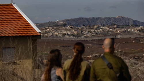 Israelis in Metula view damage from an IDF operation across the border in Lebanon, Dec. 9, 2024. Photo by Chaim Goldberg/Flash90.