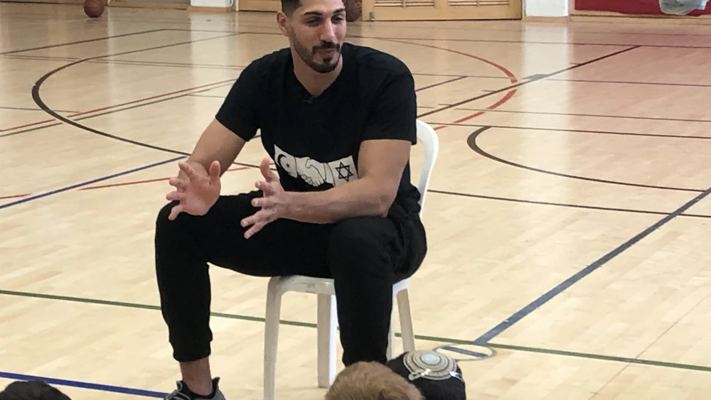 Enes Kanter Freedom answers questions at a youth basketball camp in Israel, August 2022. Photo by Josh Hasten.