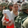 Israeli military forces and Lebanese refugees during Israel's withdrawal from Lebanon on May 29, 2000. Photo by Flash90.