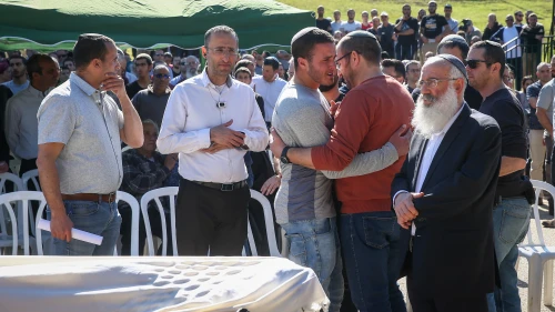 Family and friends attend the funeral of Rabbi Achiad Ettinger, who died after being shot in a terror attack near Ariel on March 17, in the Jewish settlement of Eli, March 18, 2019. Credit: Noam Revkin Fenton/Flash90.
