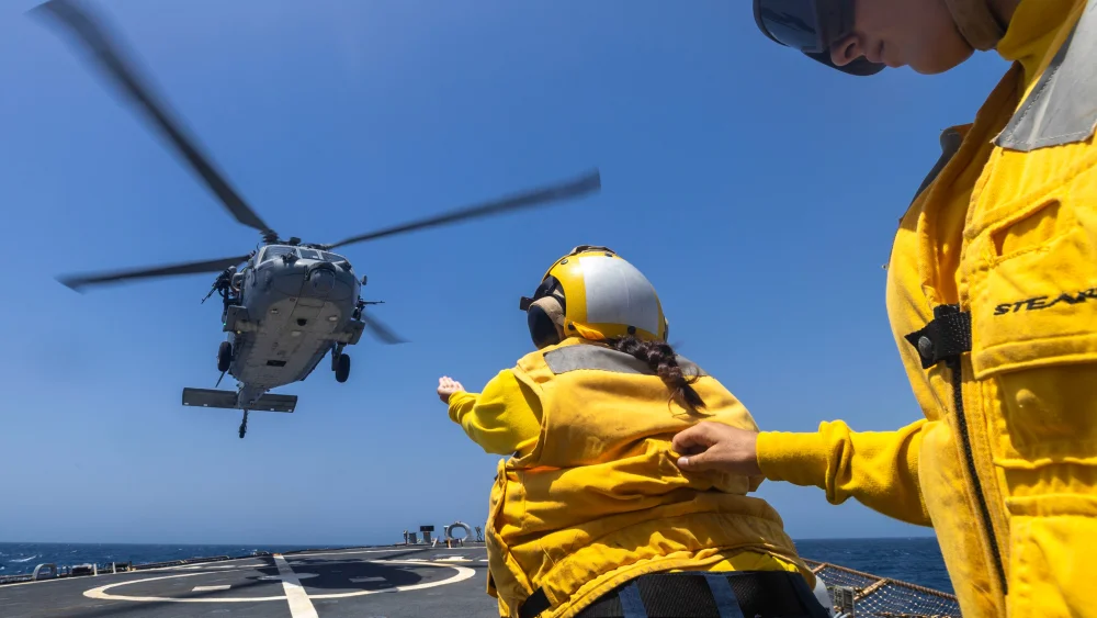 U.S. sailors guide an MH-60S Sea Hawk helicopter as it lands on the flight deck of USS Milius (DDG 69) during flight operations, May 29, 2026. Credit: United States Central Command.
