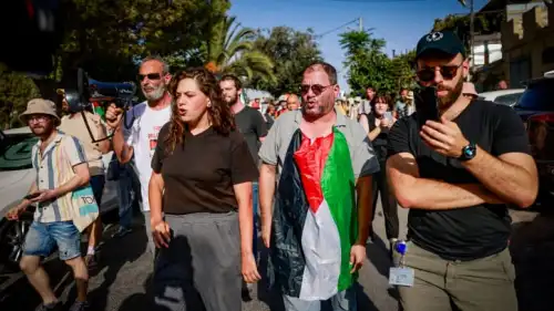 MK Ofer Cassif wears a PLO flag during a protest against the eviction of Arab families from Jewish-owned homes in the eastern Jerusalem neighborhood of Sheikh Jarrah, Sept. 8, 2023. Photo by Chaim Goldberg/Flash90.