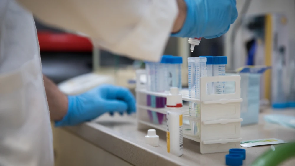 Illustrative: A researcher takes samples for testing at the Technion–Israel Institute of Technology in Haifa, on Feb. 19, 2019. Photo by Hadas Parush/Flash90.