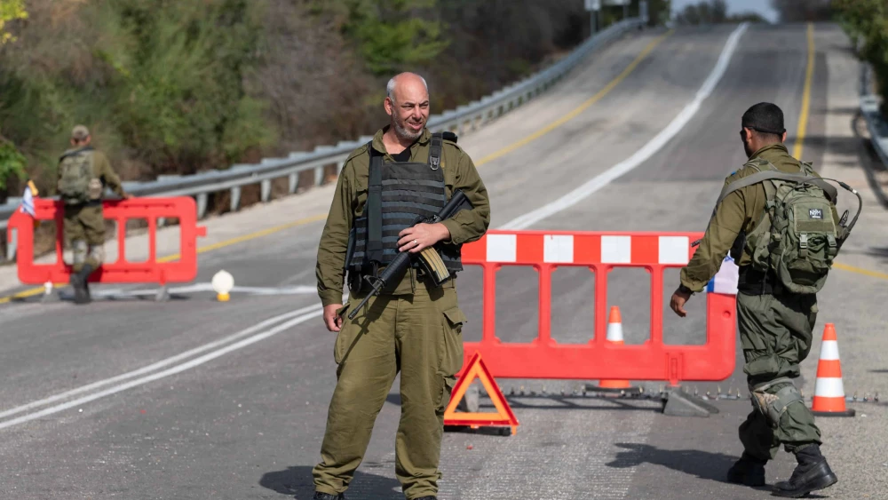 IDF soldiers but up a temporary checkpoint on a road in northern Israel, near the border with Lebanon. Oct. 17, 2023. Photo by Ayal Margolin/Flash90.