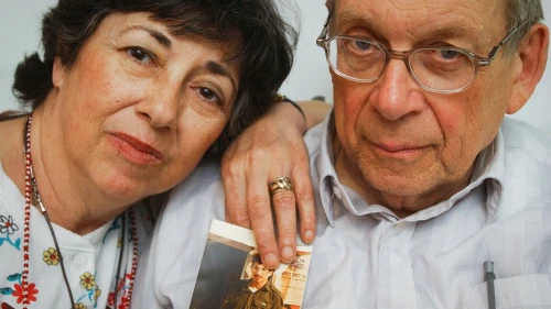 Miriam and Yoni Baumel hold a picture of their son, Zachary Baumel, who went missing in the Battle of Sultan Yacoub in 1982, in Jerusalem on July 7, 2003. Photo by Flash90.