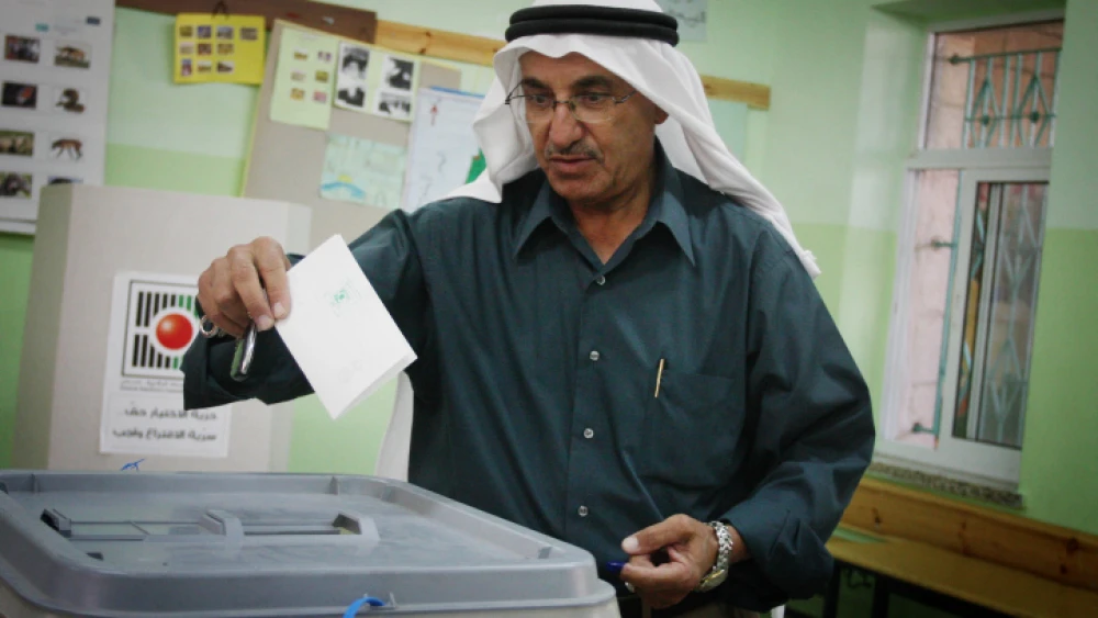 An Arab man casts his vote in the municipal elections in the West Bank town of Al-Bireh on Oct. 20, 2012. Photo by Issam Rimawi/Flash90.