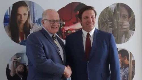Mark Rosenberg, president of Florida International University, with Florida Gov. Ron DeSantis. Credit: FIU.