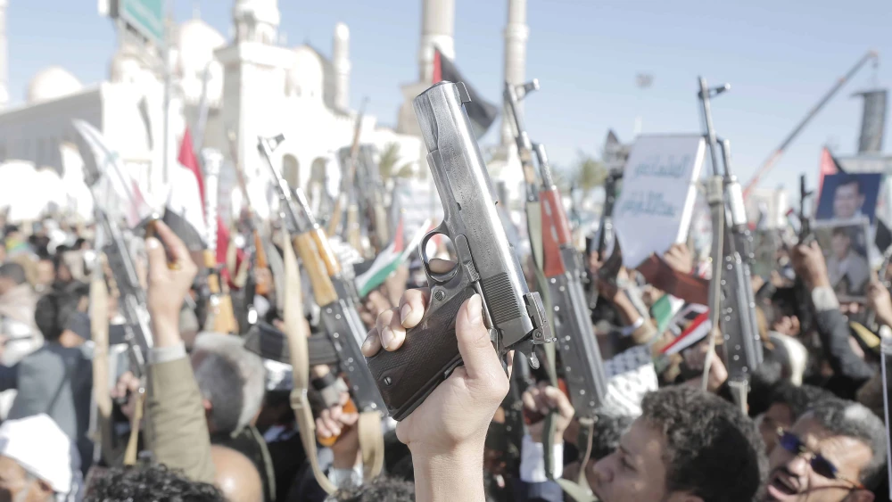 Yemen's Houthi followers brandish weapons and chant slogans as they take part in a protest staged in solidarity with the Palestinian people in Gaza, in Sana'a, Yemen, on Jan. 17, 2025. Photo by Mohammed Hamoud/Getty Images.