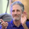 Jon Stewart applauding at the 2016 Department of Defense Warrior Games, June 21, 2016. Credit: DoD via Wikimedia Commons.