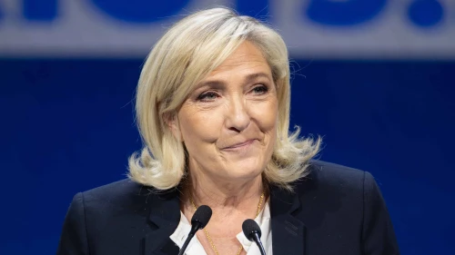 Marine Le Pen delivers a speech in Madrid on Feb. 8, 2025. Credit: Vox España via Wikimedia Commons.
