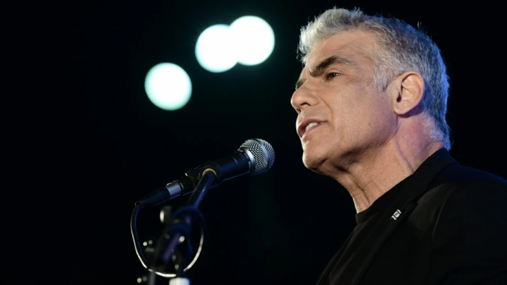 Yesh Atid leader Knesset member Yair Lapid speaks during a protest against Israeli Prime Minister Benjamin Netanyahu at Rabin Square in Tel Aviv on April 19, 2020. Photo by Tomer Neuberg/Flash90.
