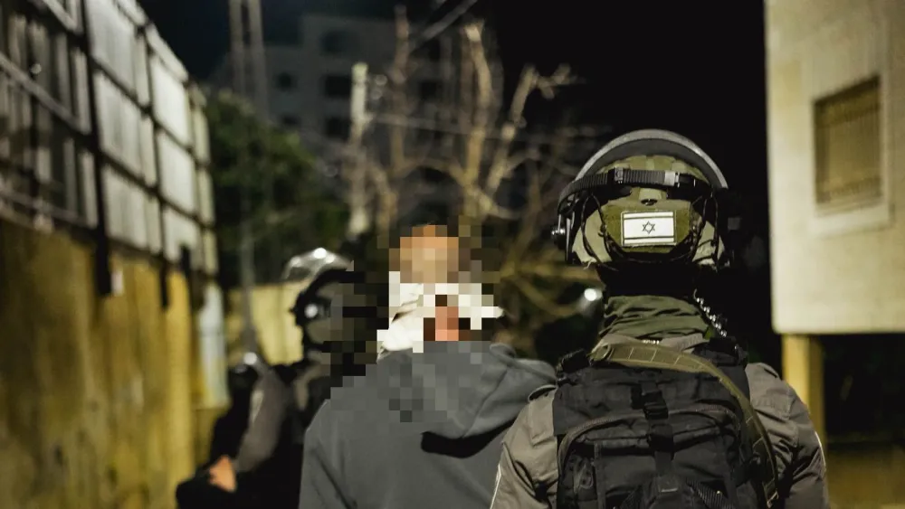 Israeli Border Police fighters apprehend a Palestinian suspect.