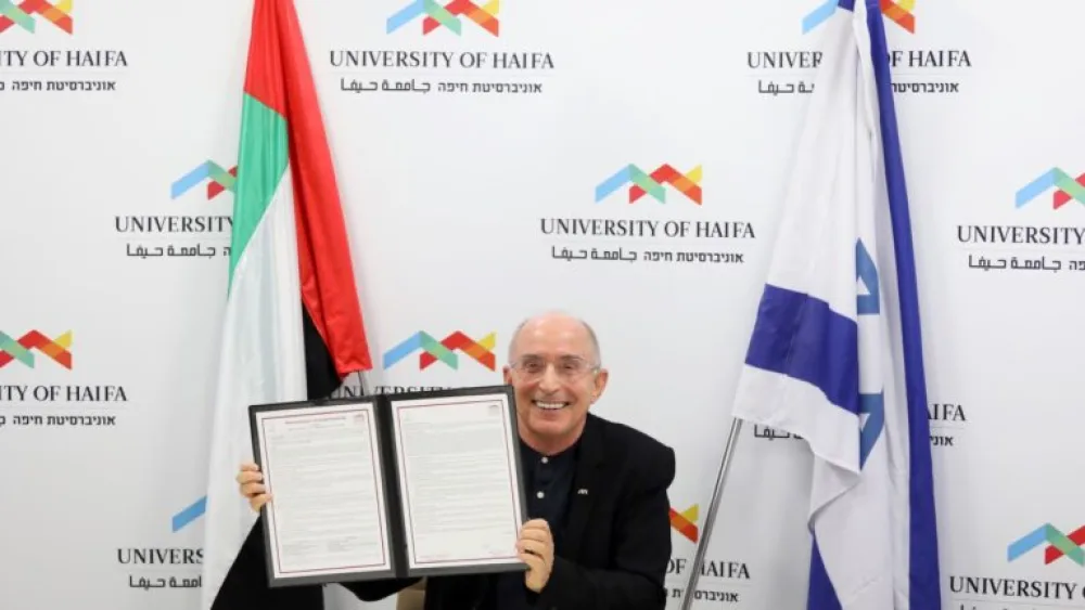 University of Haifa president Ron Robin presents the Memorandum of Understanding with the UAE’s Zayed University. Credit: The University of Haifa.
