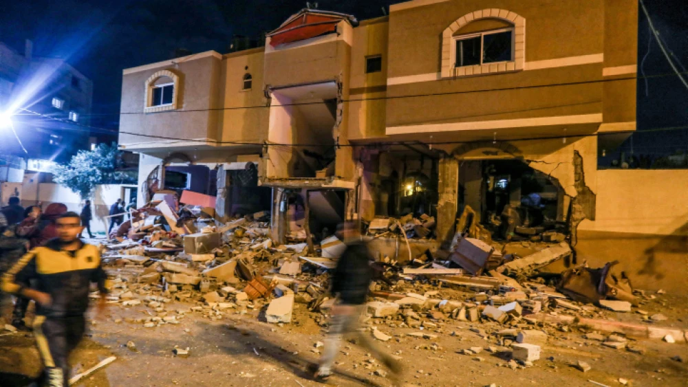 Palestinian Arabs gather near a damaged house after an Israeli airstrike in Rafah in the southern Gaza Strip, May 9, 2023. Photo by Abed Rahim Khatib/Flash90.