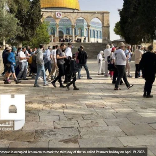 A Jewish group tours the Temple Mount under police supervision. Note the 'Al-Quds' caption claiming they were “breaking into the Al-Aqsa mosque” on the “so-called Passover holiday.” Source: Al-Quds.