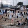 Protective face masks hang on a fence in Glilot, Feb. 14, 2022. Photo by Tomer Neuberg/Flash90.