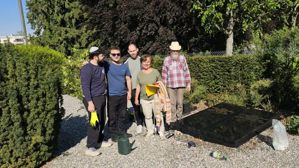 Members of the Jewish community in Lausanne, Switzerland seen during a cleanup project in a local Jewish cemetery. Credit: The Yael Foundation.
