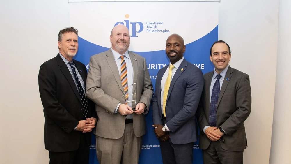 (Left to right) Jeremy Yamin, vice president of security & operations at Combined Jewish Philanthropies; Daniel E. Levenson, senior director of the Communal Security Initiative at Combined Jewish Philanthropies and recipient of the FBI Director’s Community Leadership Award; Ted E. Docks, special agent in charge of the FBI's Boston Division; and Rabbi Marc Baker, president and CEO of Combined Jewish Philanthropies, Sept. 23, 2026. Credit: FBI Boston.