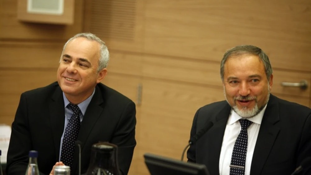 Yuval Steinitz (left), Israeli Minister of International Relations and Strategic Affairs, and Avigdor Lieberman at a Foreign Affairs and Defence committee meeting in the Israeli Parliament in Jerusalem on May 20, 2013. Steinitz on Monday said There is a “real possibility” that Syrian President Bashar al-Assad “could survive Syria’s civil war and even prevail in it.” Photo by Flash90.