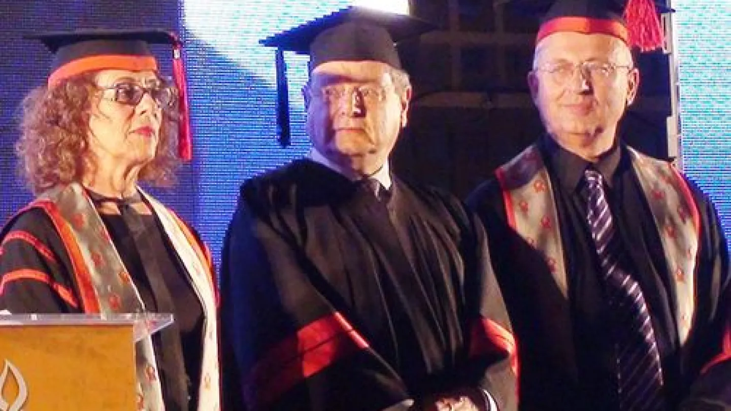 Click photo to download. Caption: Sir Martin Gilbert (center) is awarded an honorary doctorate at Ben Guion University in Be'er Sheva, Israel, in May 2011. Credit: Wikimedia Commons.