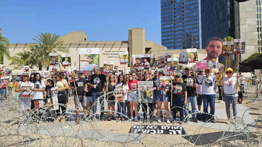 Relatives of the 50 captives in Gaza hold a demonstration at "Hostage Square" in Tel Aviv under the banner “Never Again," Aug. 2, 2025. Photo by Paulina Patimer.