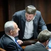 Israeli Prime Minister-designate Benjamin Netanyahu speaks with Religious Zionism Party head Bezalel Smotrich during a vote at the Knesset in Jerusalem, on Dec. 20, 2022. Photo by Yonatan Sindel/Flash90.