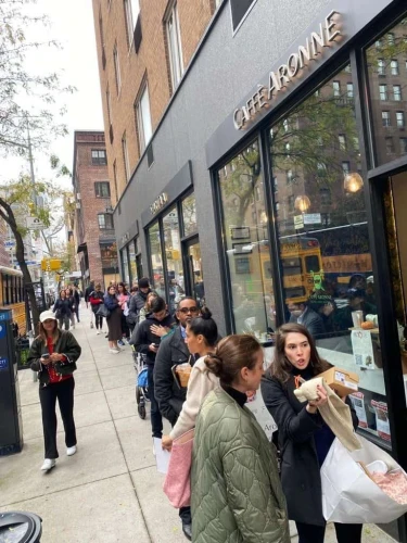 Customers wait in line for a cup of coffee at Caffe Aronne in New York City, November 2023. Credit: Courtesy.