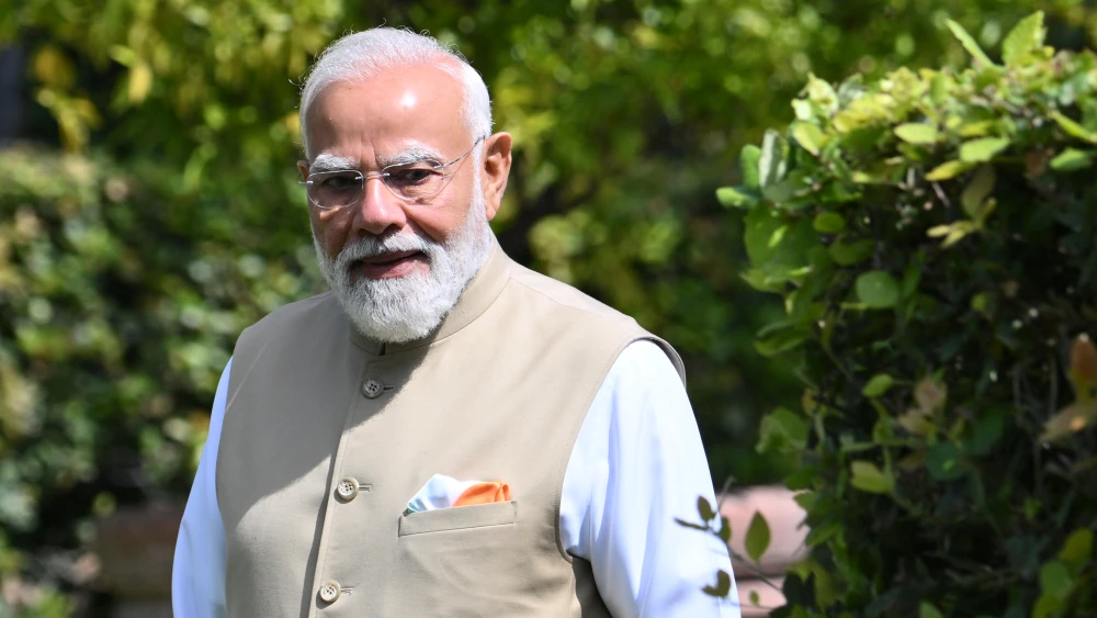 Indian Prime Minister Narendra Modi stands after planting a tree with the Italian prime minister at Villa Doria Pamphili in Rome on May 20, 2026. Photo by Alberto Pizzoli / AFP via Getty Images.