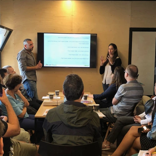 ADMA co-founders Amos Darr (left) and right Moran Amikam presenting at the open house at the ADMA Architecture Studio in the Clal Center in Jerusalem on Nov. 1, 2019. Credit: ADMA.