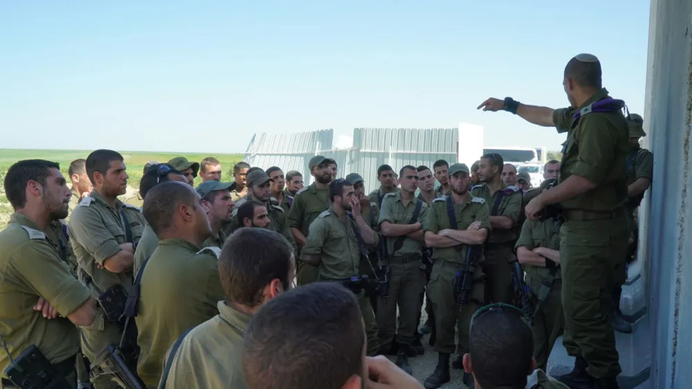 Givati infantry soldiers get instructions for their urban combat drills. Credit: IDF Spokesperson Unit.