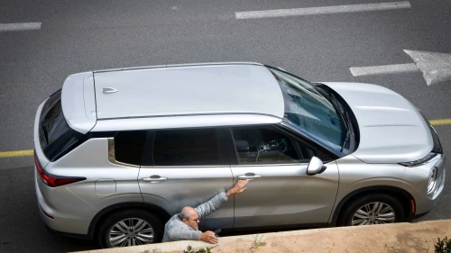 Israelis take cover on the Ayalon Highway as rocket sirens sound in Tel Aviv, March 20, 2025. Photo by Avshalom Sassonif/Flash90.