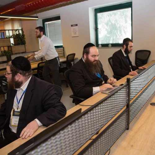 Ultra-Orthodox men work at the Bizmax Innovative Business Complex in Jerusalem, which endeavors to integrate Haredi men into various careers, Feb. 23, 2017. Credit: Flash90.