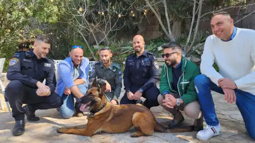 Maor (second from left) and the police officers who reunited him with Jila. Credit: Israel Police.