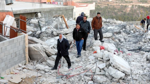 Palestinians inspect the damage following the demolition by Israel of the family home of a suspect in the murder of Dvir Sorek, in the village of Beit Kahel near Hebron, Nov. 28, 2019. Photo by Wisam Hashlamoun/Flash90.