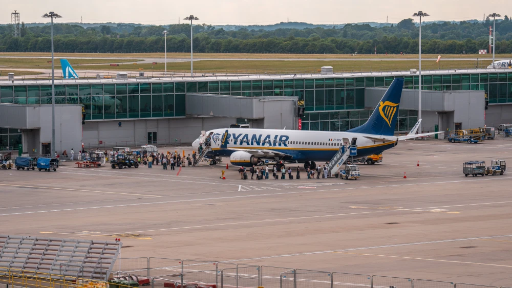 People board a plane on July 30, 2025 in Stansted, Essex. Photo by Carl Court/Getty Images.